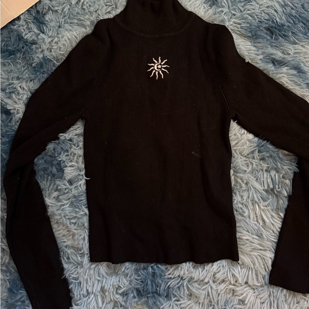 Black Turtleneck Sweater with Sun Embroidery